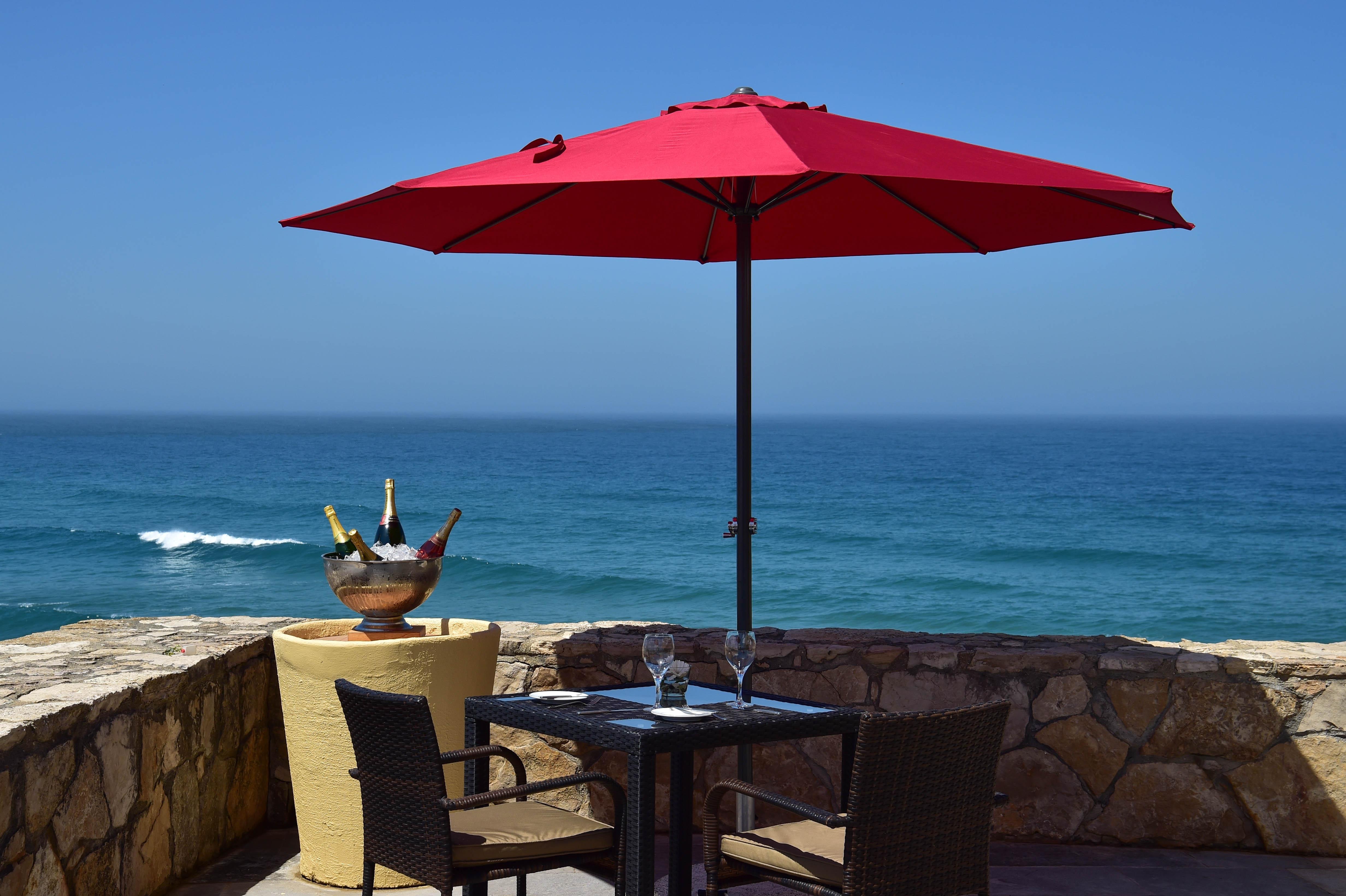 Hotel Fortaleza Do Guincho Relais & Chateaux Cascais Exterior foto A patio umbrella